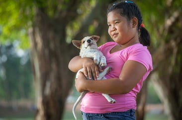 obese girl holding dog