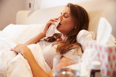 woman in bed with the flu